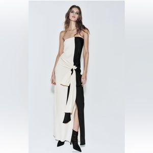 Beautiful dress . New and super versatile. Color ivory/black